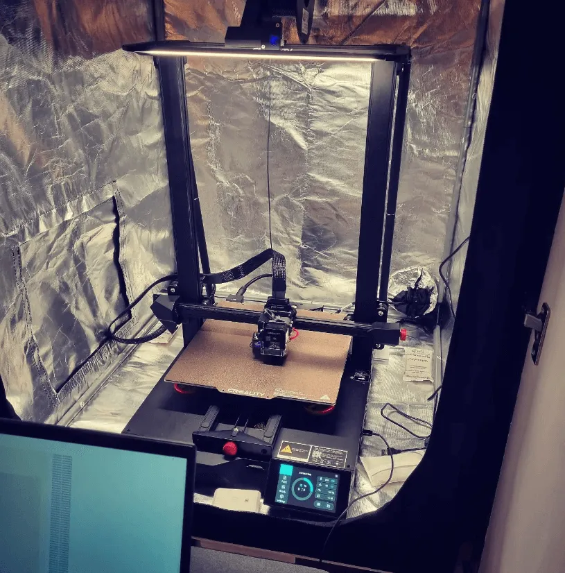 3D printer being setup with laptop